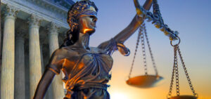 Peter Wachowski, Attorney at Law page header. Image of a justice statue with a courthouse in the background.