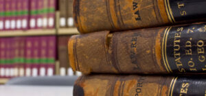 Peter Wachowski Legal Resources. Image of old books sitting in front of a bookshelf.