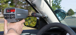 Peter Wachowski Speeding Ticket Lawsuits. Image of a police officer holding a radar gun.