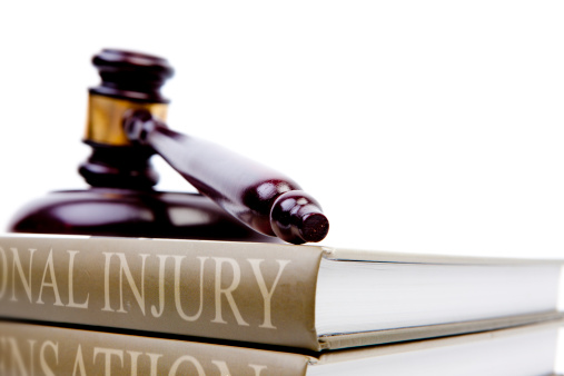 Personal Injury Liability FAQ blog image. Photo of a gavel resting on a personal injury law book.