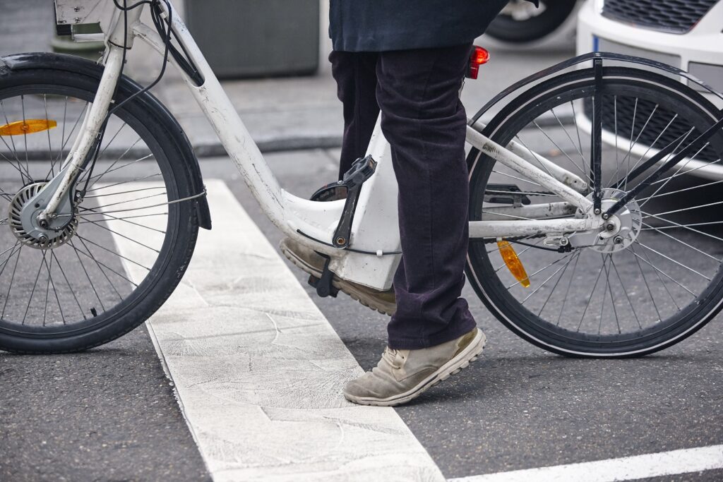 Micromobility Law blog. Image of a person riding an ebike on a public street.