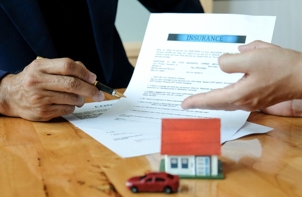 Insurance Coverage & Micromobility blog. Image of a lawyer signing documents