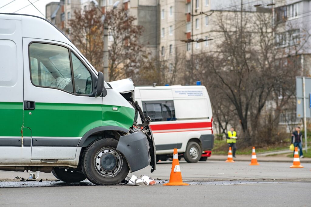 The Contractor's Guide to Vehicle Accidents & Personal Injuries blog. Photo of ambulances at a job site.